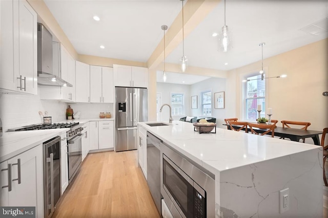 512 Peabody St NW, Washington, DC 20011 - kitchen with a sink, wall chimney range hood, a wealth of natural light, and stainless steel appliances