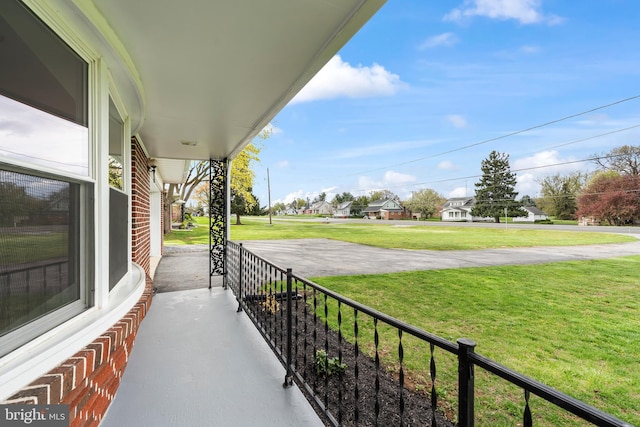 balcony with a residential view and covered porch