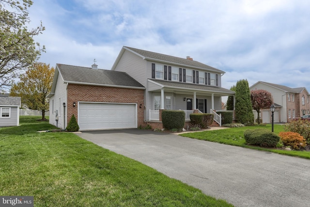 227 Cooper Rd, Hummelstown, PA 17036 - view of front of property with a chimney, covered porch, brick siding, an attached garage, and aphalt driveway