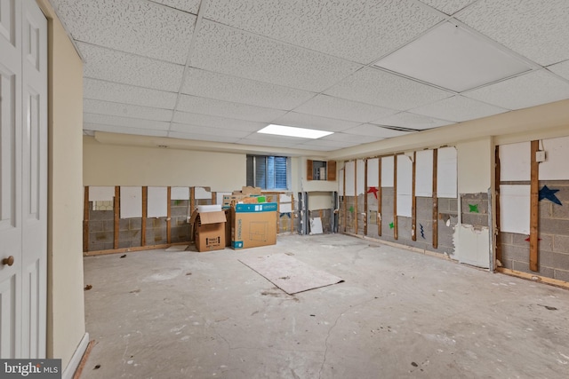 basement featuring a drop ceiling