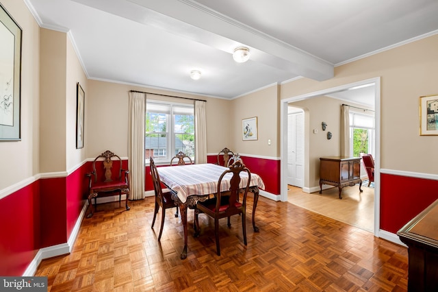 dining area with baseboards and ornamental molding