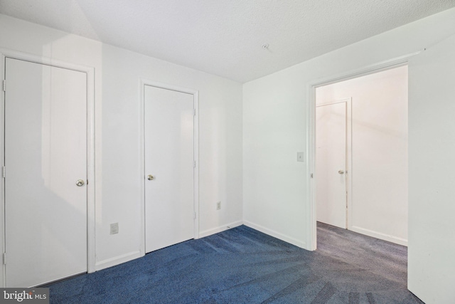 2715 Snowbird Ter Unit 4-28, Silver Spring, MD 20906 - unfurnished bedroom with dark colored carpet and baseboards