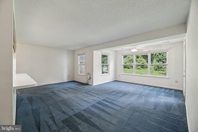 2715 Snowbird Ter Unit 4-28, Silver Spring, MD 20906 - unfurnished room featuring dark carpet, baseboards, ceiling fan, and a textured ceiling