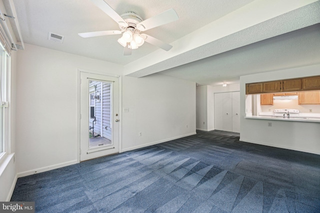 2715 Snowbird Ter Unit 4-28, Silver Spring, MD 20906 - unfurnished living room with dark colored carpet, baseboards, a ceiling fan, and a sink