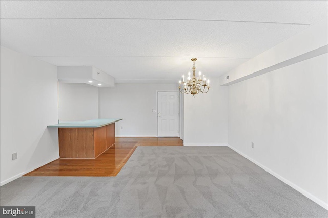615 Brandon Rd, Norristown, PA 19403 - carpeted spare room featuring a chandelier and baseboards
