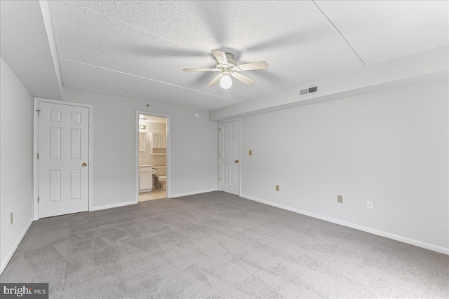 615 Brandon Rd, Norristown, PA 19403 - unfurnished bedroom featuring carpet, baseboards, connected bathroom, a textured ceiling, and a ceiling fan