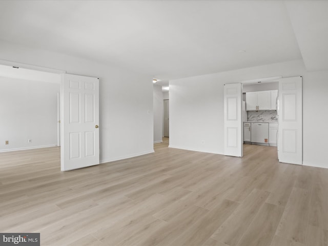 3800 Powell Ln Unit 828, Falls Church, VA 22041 - unfurnished living room with light wood-type flooring and baseboards