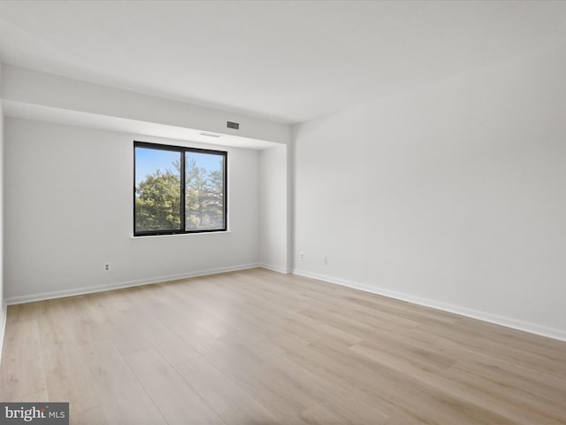 3800 Powell Ln Unit 828, Falls Church, VA 22041 - unfurnished room featuring light wood-style flooring and baseboards