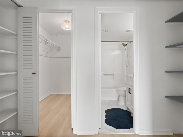 3800 Powell Ln Unit 828, Falls Church, VA 22041 - full bath with wood finished floors, baseboards, vanity, and toilet