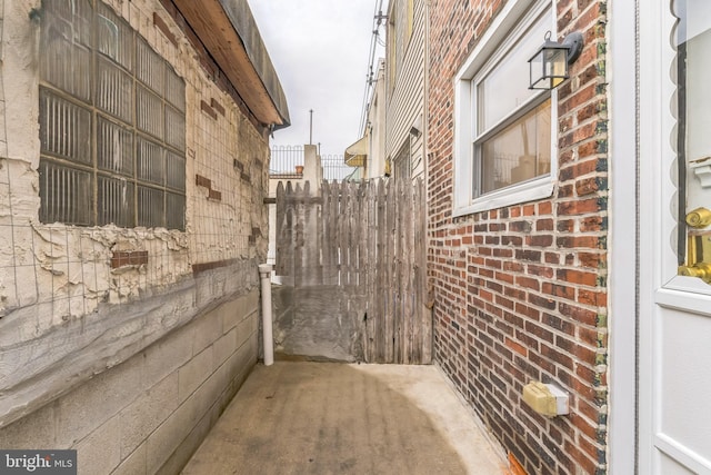 view of side of property featuring brick siding