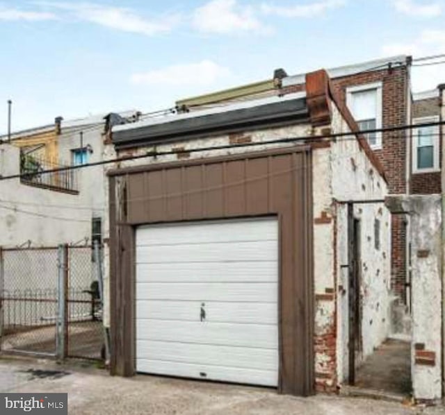 garage with fence