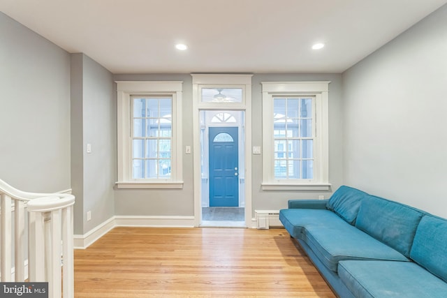 entrance foyer featuring baseboards, light wood finished floors, and recessed lighting