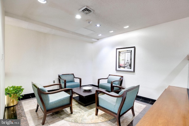 203 Yoakum Pkwy Unit 1520, Alexandria, VA 22304 - living area with visible vents, baseboards, recessed lighting, a textured ceiling, and tile patterned floors