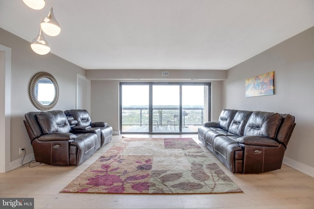 203 Yoakum Pkwy Unit 1520, Alexandria, VA 22304 - living room featuring baseboards, light wood finished floors, and visible vents