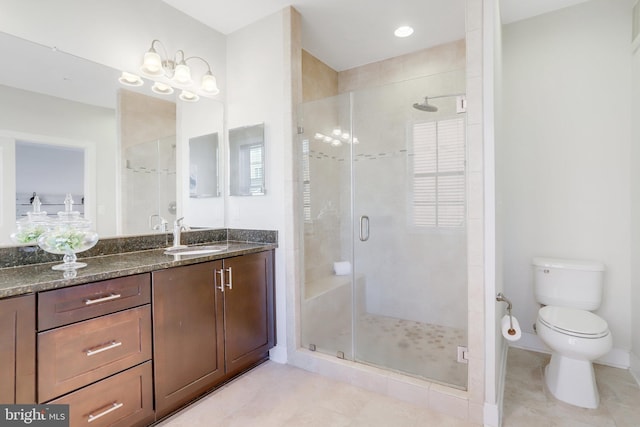 full bathroom with vanity, toilet, tile patterned flooring, and a stall shower