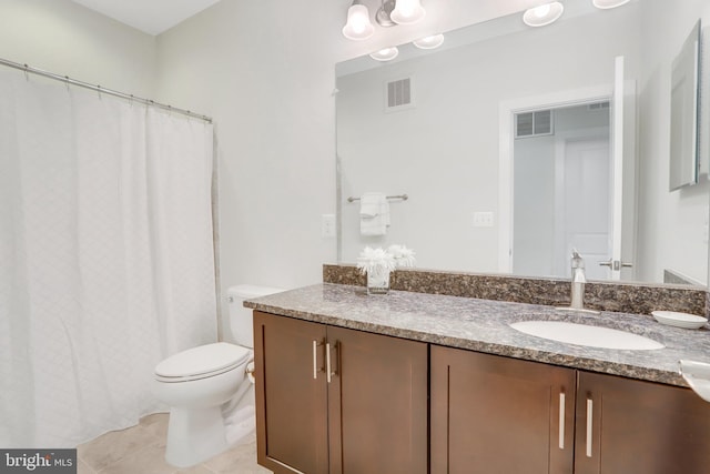 bathroom featuring visible vents, tile patterned flooring, toilet, and vanity