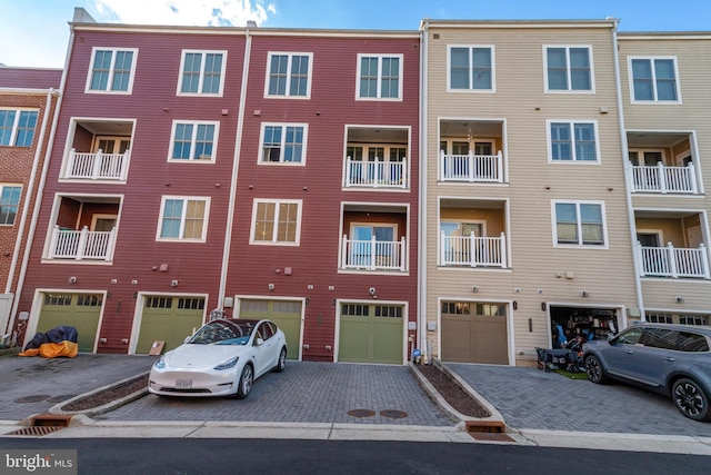 view of building exterior with a garage and driveway