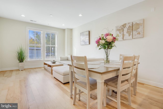 dining area featuring light wood-type flooring, recessed lighting, baseboards, and visible vents