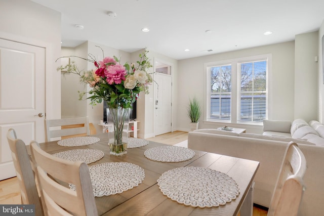 dining area featuring recessed lighting, light wood finished floors, and baseboards