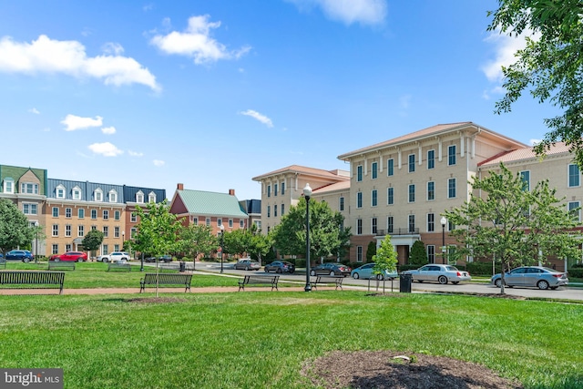 view of home's community featuring a lawn