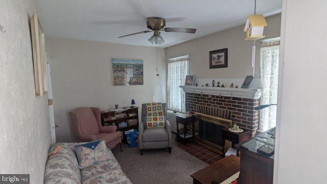 living room featuring a fireplace and ceiling fan