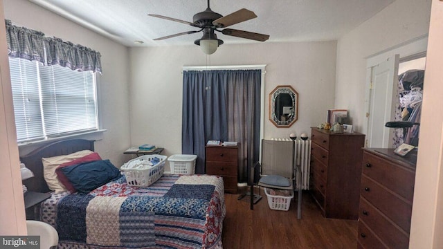 bedroom featuring a ceiling fan and wood finished floors