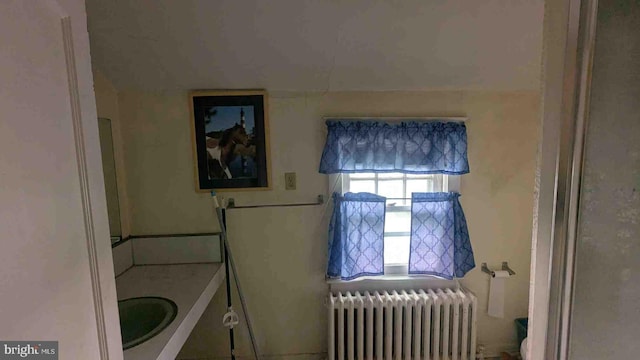 bathroom with radiator heating unit