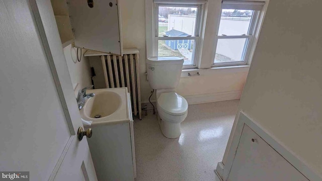 bathroom with toilet and vanity