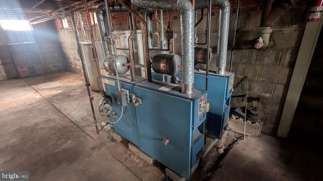 utility room featuring gas water heater