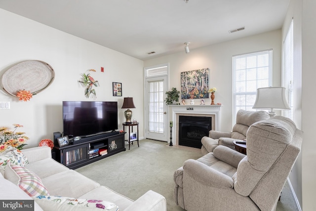 400 Symphony Cir Unit 351, Cockeysville, MD 21030 - living area with a fireplace with flush hearth, visible vents, carpet, and a healthy amount of sunlight
