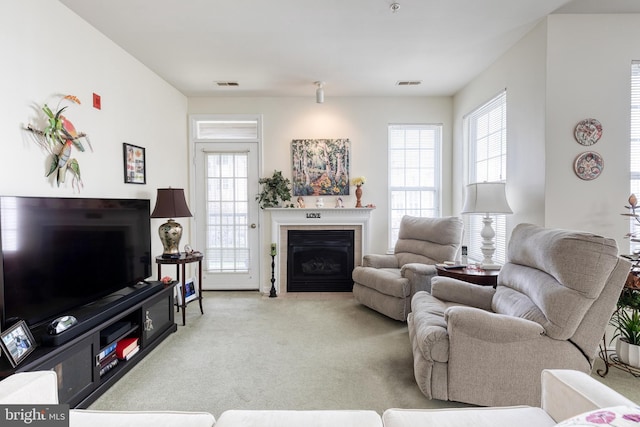 400 Symphony Cir Unit 351, Cockeysville, MD 21030 - living room featuring a fireplace with flush hearth, light carpet, and visible vents