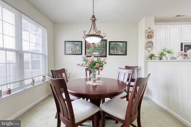 400 Symphony Cir Unit 351, Cockeysville, MD 21030 - dining room with light colored carpet, a healthy amount of sunlight, and visible vents