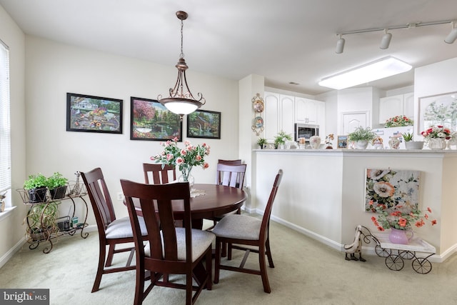400 Symphony Cir Unit 351, Cockeysville, MD 21030 - dining room featuring track lighting, light carpet, and baseboards