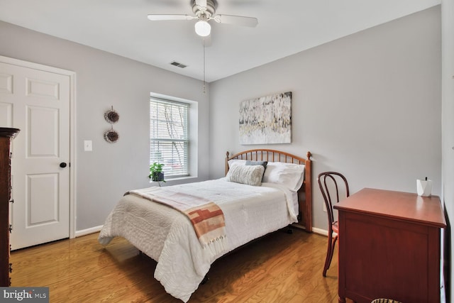 12105 Tullamore Ct Unit 101, Lutherville Timonium, MD 21093 - bedroom featuring baseboards, ceiling fan, wood finished floors, and visible vents