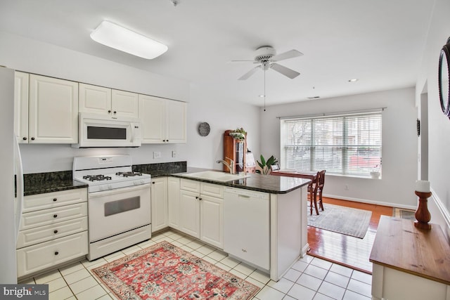 12105 Tullamore Ct Unit 101, Lutherville Timonium, MD 21093 - kitchen featuring a sink, a peninsula, white appliances, white cabinetry, and a ceiling fan