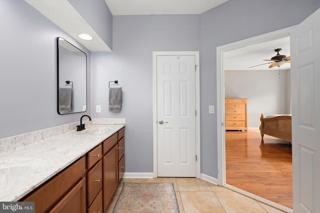 16260 Edgewater Dr, Milton, DE 19968 - bathroom featuring baseboards, double vanity, a ceiling fan, and tile patterned floors