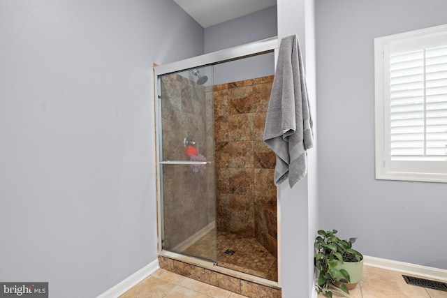 16260 Edgewater Dr, Milton, DE 19968 - bathroom featuring a shower stall, baseboards, and tile patterned flooring
