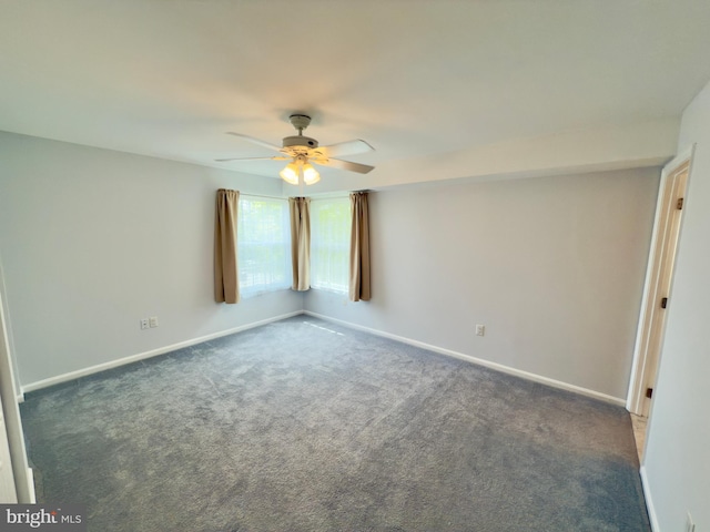 carpeted empty room with baseboards and a ceiling fan