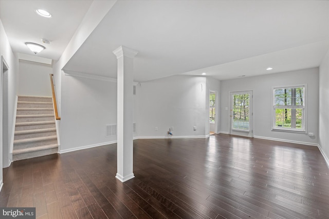 unfurnished living room featuring recessed lighting, baseboards, wood finished floors, visible vents, and stairway