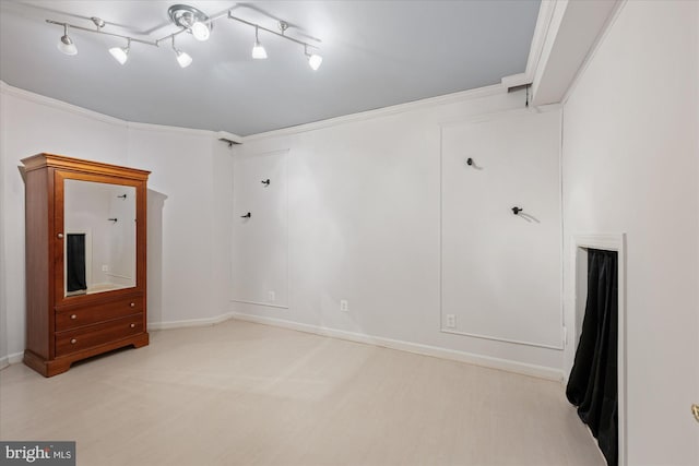unfurnished room featuring baseboards and ornamental molding