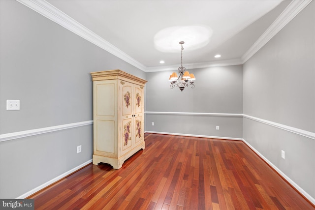 unfurnished dining area with crown molding, hardwood / wood-style flooring, baseboards, a chandelier, and recessed lighting