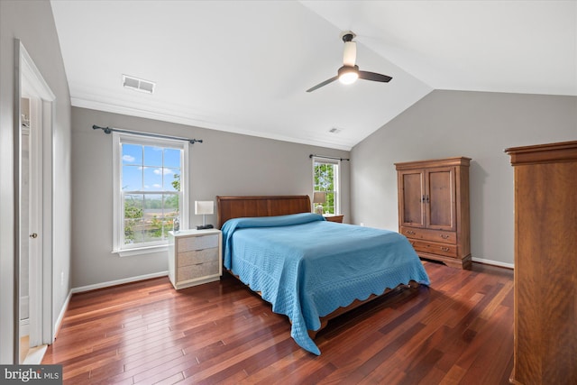 bedroom featuring ceiling fan, vaulted ceiling, wood finished floors, and visible vents