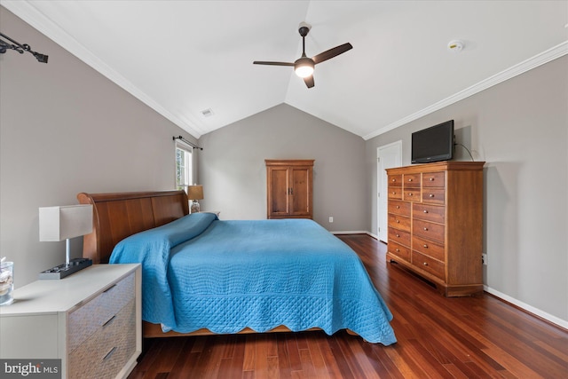 bedroom with crown molding, lofted ceiling, wood finished floors, and visible vents