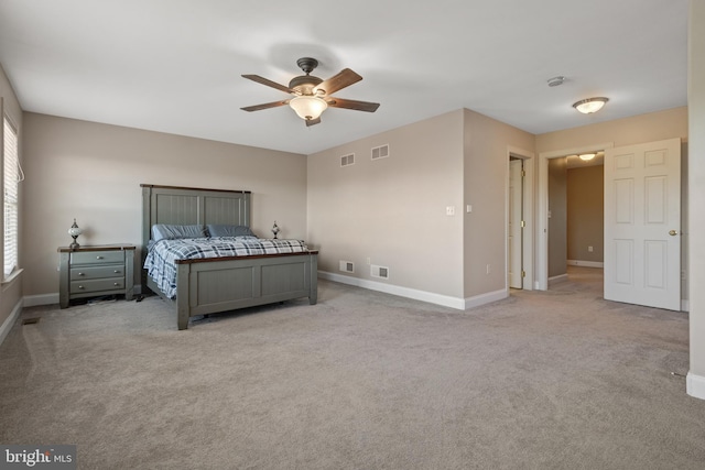 bedroom with light colored carpet, baseboards, and visible vents