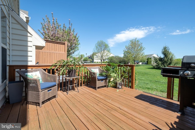 wooden terrace featuring a lawn