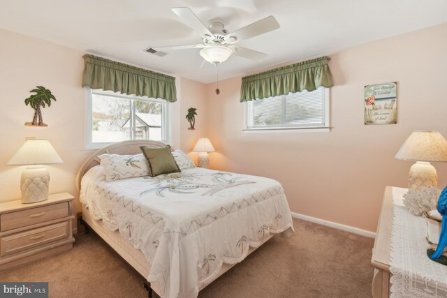 9007 Coastal Hwy, Ocean City, MD 21842 - bedroom featuring baseboards, visible vents, light colored carpet, and ceiling fan