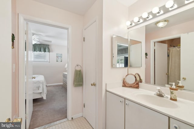 9007 Coastal Hwy, Ocean City, MD 21842 - bathroom featuring baseboards, vanity, connected bathroom, and tile patterned floors