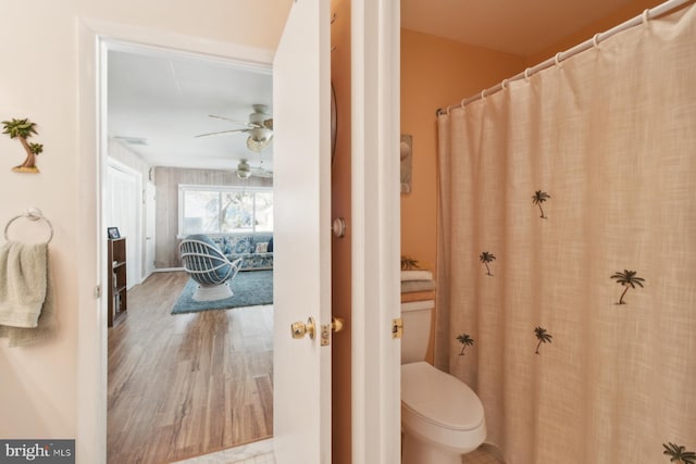 9007 Coastal Hwy, Ocean City, MD 21842 - bathroom featuring wood finished floors, ceiling fan, and toilet