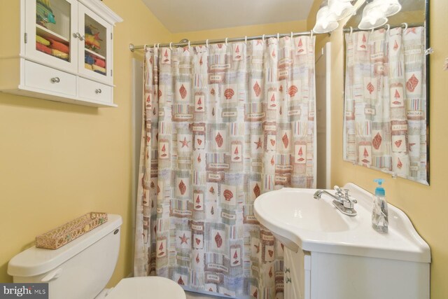 9007 Coastal Hwy, Ocean City, MD 21842 - full bathroom featuring toilet, a shower with shower curtain, and a sink