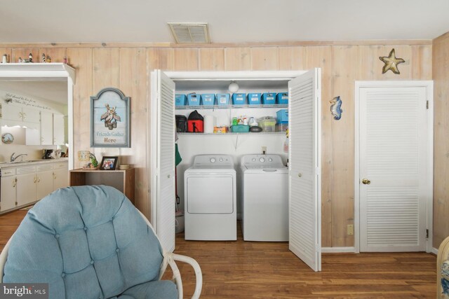 9007 Coastal Hwy, Ocean City, MD 21842 - washroom with wood finished floors, visible vents, separate washer and dryer, and laundry area